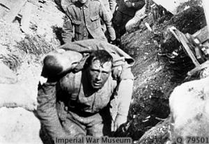 "Tommy rescuing a comrade under shell-fire"