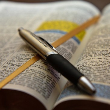 Opened Bible with pen