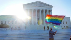 Rainbow flag waving before Supreme Court in April 2015