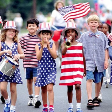 Children marching in a 4th of July parade