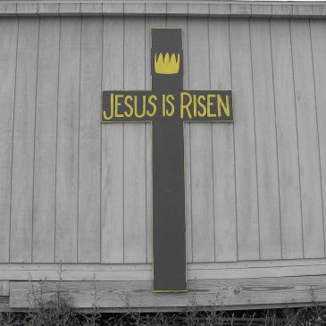 Wooden cross inscribed, "Jesus is Risen"