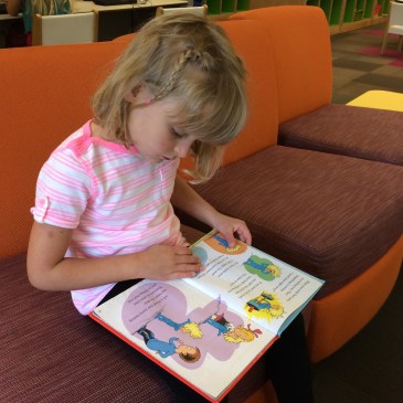 Lena reading in our local library