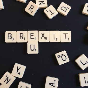 Scrabble tiles forming Brextit and EU
