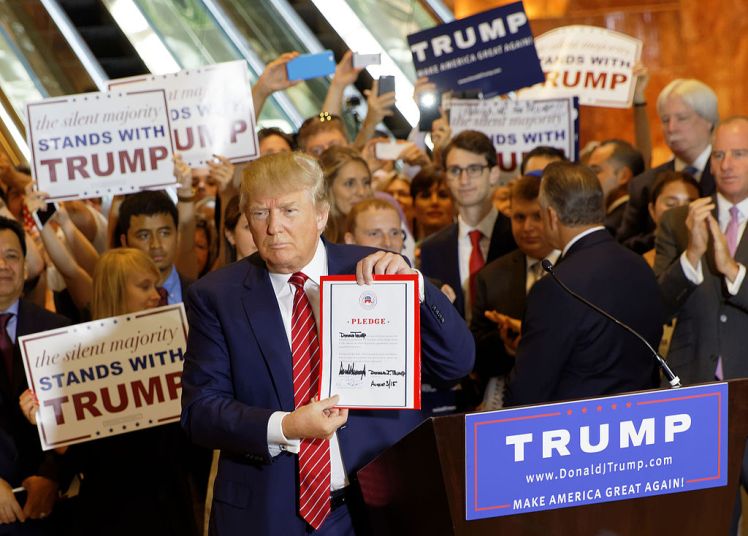 Sept. 2015 photo of Trump signing a pledge to support the GOP nominee