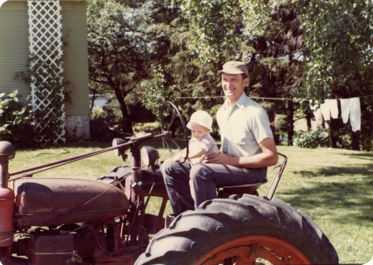 Grandpa Peterson and me on his tractor