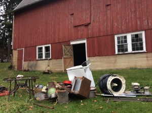 The scrap metal heap grows, next to the barn