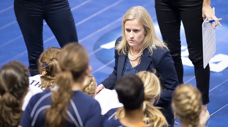 Gretchen Hunt coaching Bethel University's women's volleyball team